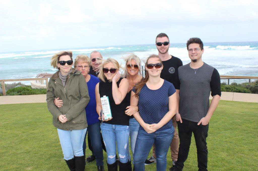 Group photo overseeing the windy ocean on Margaret River tour
