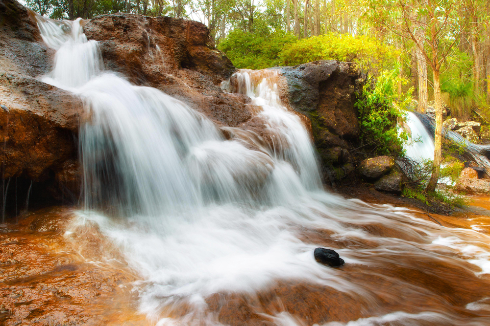 Peaceful stream at the Ironstone Gully Falls in Capel, Western Australia