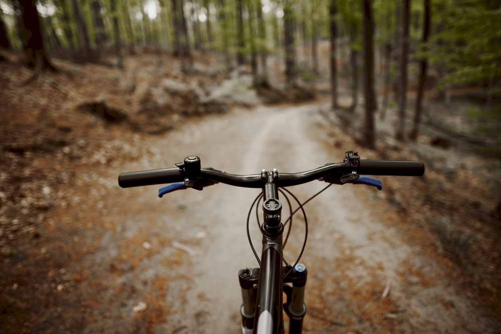 Mountain biker front view picture on a mountain bike trail